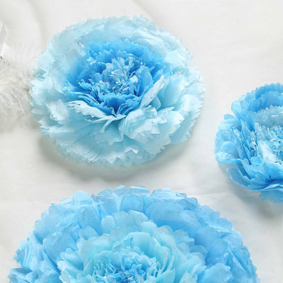 Blue paper flowers in various sizes on a light background.
