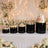 Elegant wedding dessert table with cakes, cupcakes, macarons, and floral decor