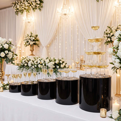 Elegant wedding champagne tower with white floral decor and gold accents
