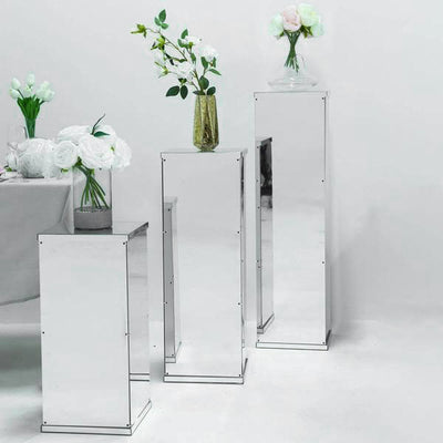 Mirrored display pedestals for elegant floral arrangements