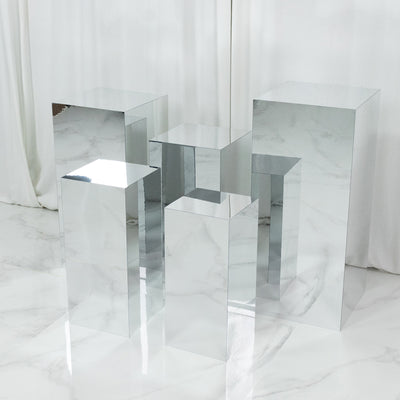 Reflective geometric display pedestals in various heights.