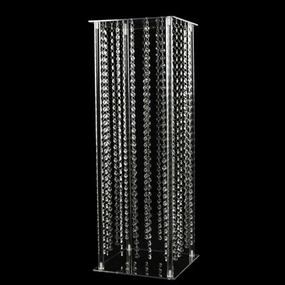 Acrylic decorative tower with hanging crystal strands.