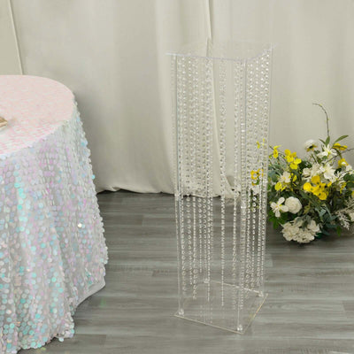 Acrylic display stand with decorative beads for events and parties.