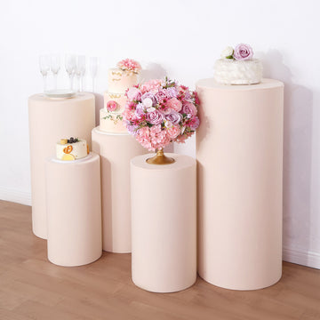 Enhance Your Event Decor with Blush Spandex Cylinder Plinth Covers