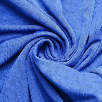 Blue textured fabric in a swirling pattern.