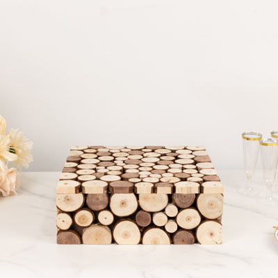 Wooden log slice display stand on a marble surface.