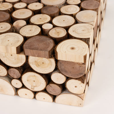 Wooden log side table with natural textures and circular patterns.