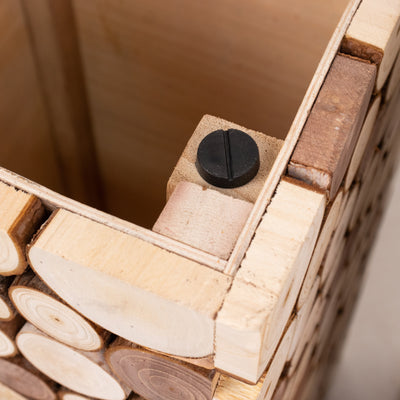 Wooden storage box corner detail with black fastener.