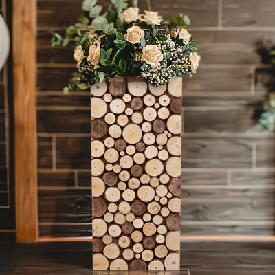 Rustic wood log vase filled with flowers in a modern setting.