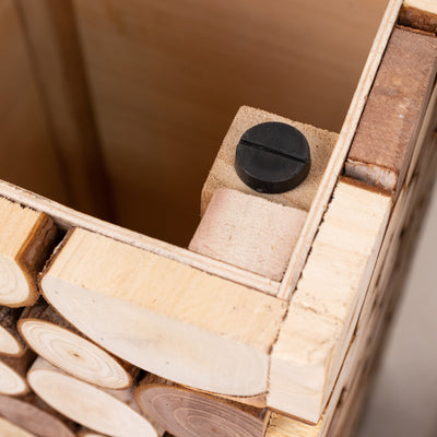 Wooden storage box corner detail with black fastener.