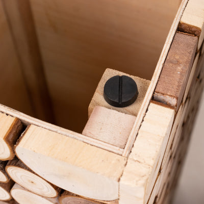 Wooden storage box corner detail with black fastener.