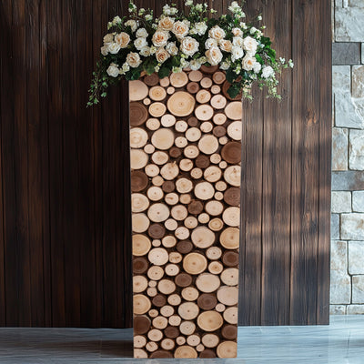 Wooden pedestal vase with flowers, featuring a rustic log design.