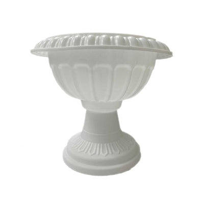 White decorative urn with intricate detailing