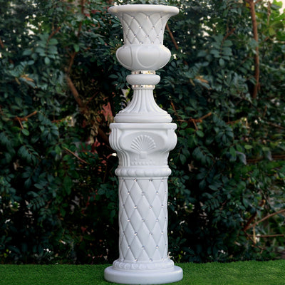 Elegant white decorative pedestal vase with intricate detailing and a classic design.