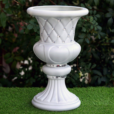 Elegant white decorative vase with diamond-like accents and a classic design.