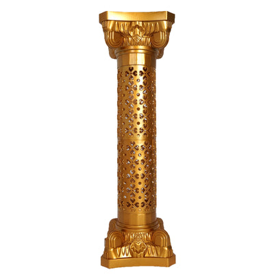Golden decorative column with intricate cutout patterns