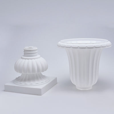 White decorative vase and base on a plain backdrop