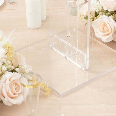 Acrylic display stand with floral arrangements on a table.
