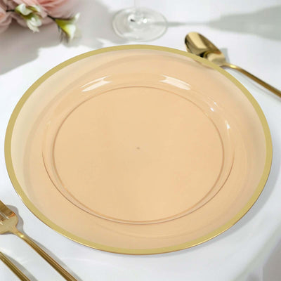Elegant peach plate with gold rim, perfect for dining occasions.