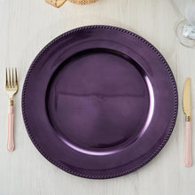Acrylic purple charger plates with a round shape and beaded rim design, measuring 13 inches and 9 in