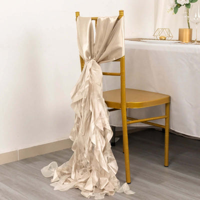 Elegant beige chair sash draped on a gold chair in a styled dining setting.