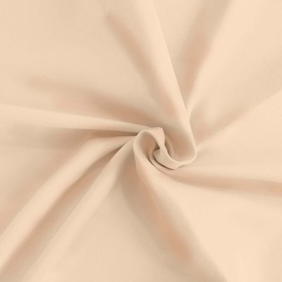 Beige stretchy fabric showing soft texture and drape.