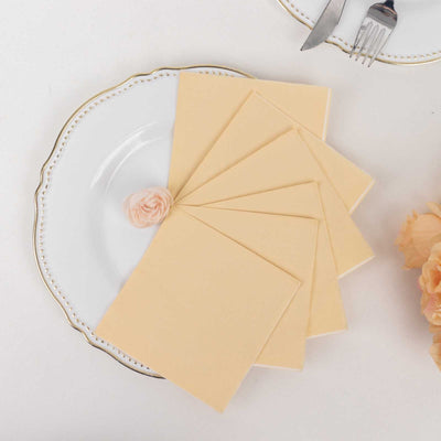 Peach-colored stationery on a decorative plate with a flower accent.