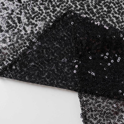 Black sequin fabric with a shimmering texture.