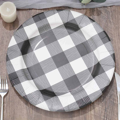 Black and white checkered paper plate on a wooden table.
