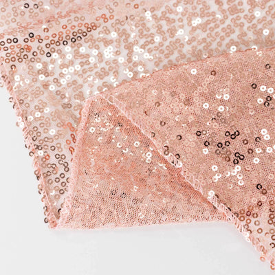 Rose gold sequin fabric showcasing shimmering texture and detail.
