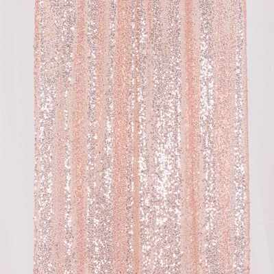 Pink and silver sequin fabric with vertical stripes.