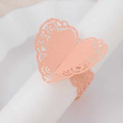 Peach lace heart napkin holder on a white background