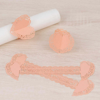 Peach lace paper decorations for party favors and table settings.