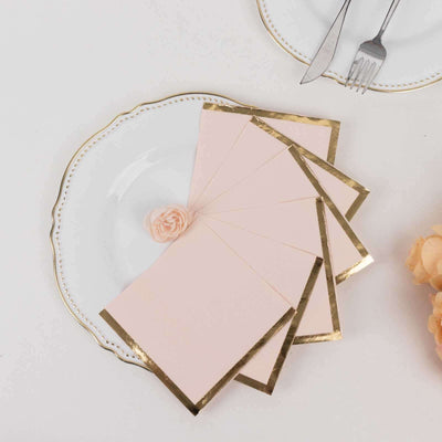 Pink greeting cards with gold edges on a decorative plate