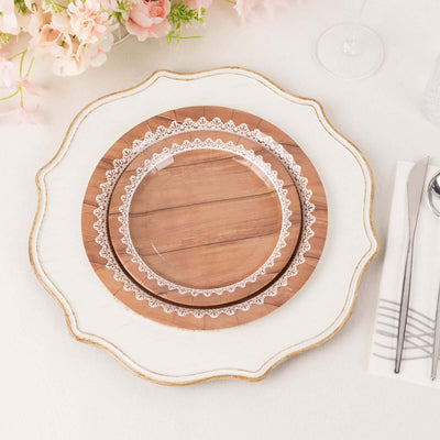 Decorative wooden plates stacked on a white serving platter.