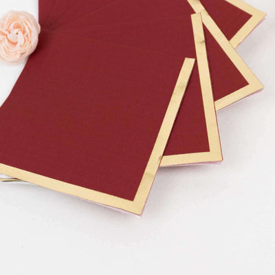 Burgundy cards with gold foil edges, perfect for invitations or stationery.