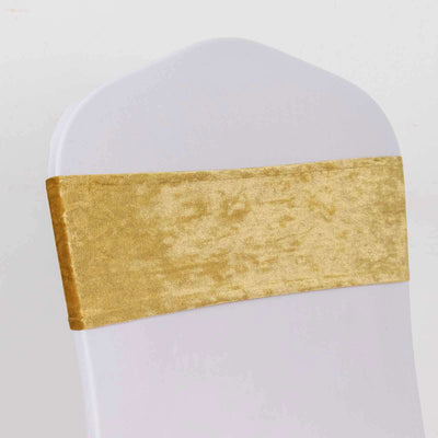 Gold velvet chair sash on a white chair.
