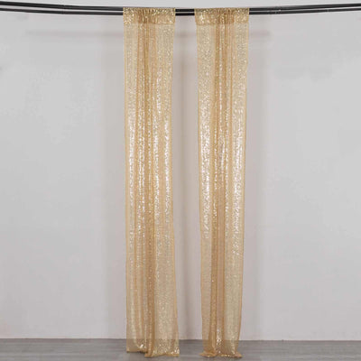 Gold sequin curtains hanging in a studio setting