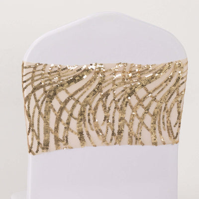 Gold sequin chair sash with wavy design on a white chair