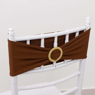 Brown chair sash with rhinestone buckle on white chiavari chair.