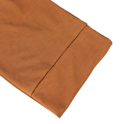 Brown fabric close-up showcasing sleeve detail.