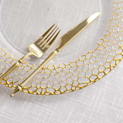 Gold-accented cutlery set on a decorative plate