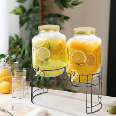 Lemonade dispensers with fresh fruit on a stylish stand