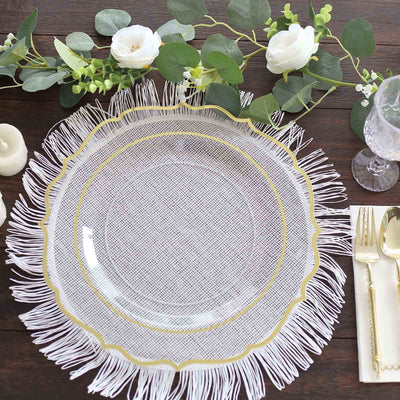 Elegant glass plate with fringe and gold accents on a rustic table setting.