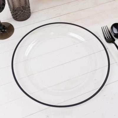 Clear plate with black rim on a wooden surface.