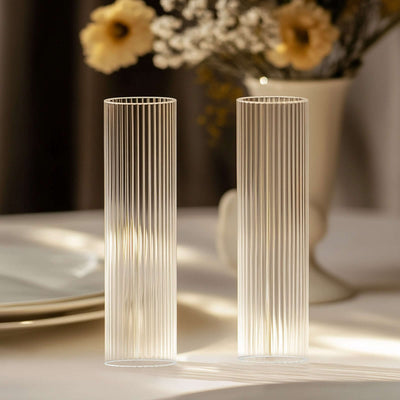 Elegant ribbed glass vases in a soft light setting.
