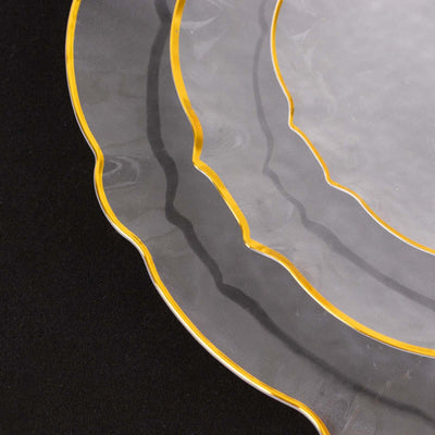 Elegant clear plates with gold trim, showcasing a unique scalloped design.