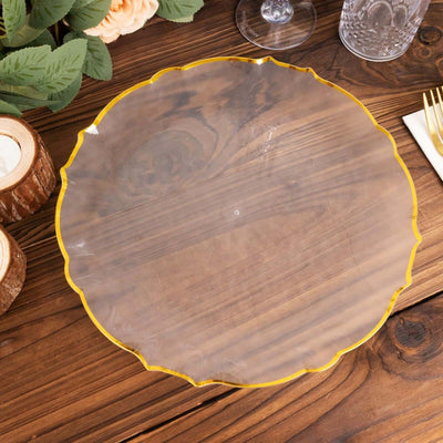 Clear scalloped edge serving platter on a wooden table.