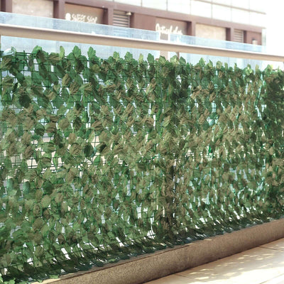 Artificial green leaf privacy screen for outdoor spaces.