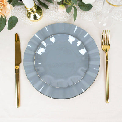 Elegant gray plate with gold trim, accompanied by gold cutlery.